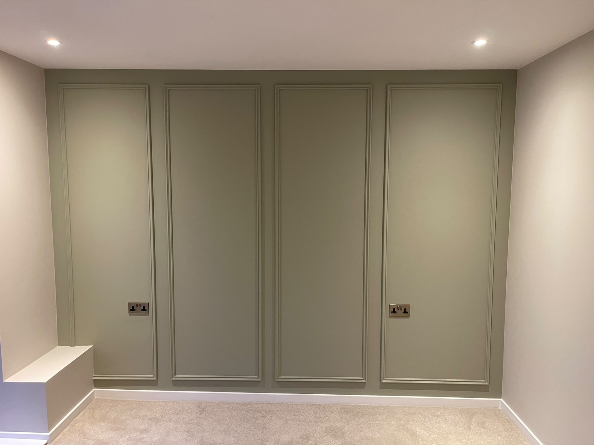 Islington decorative wall with tall painted rectangular mouldings and contrasting white trim