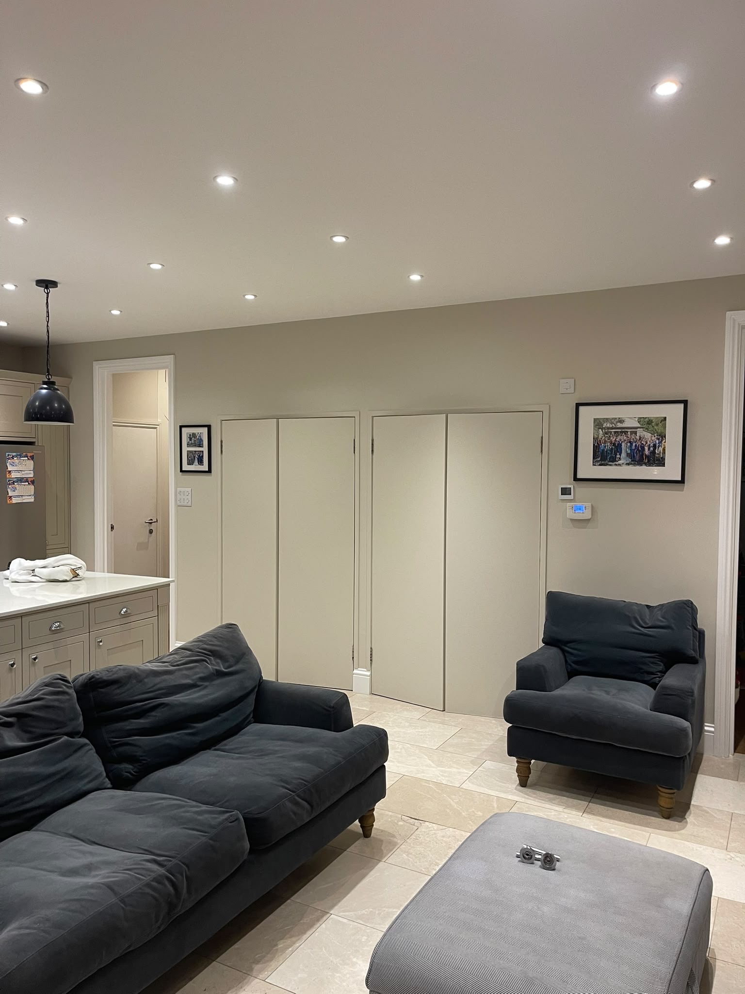 Painted living area with white double doors and skirting boards