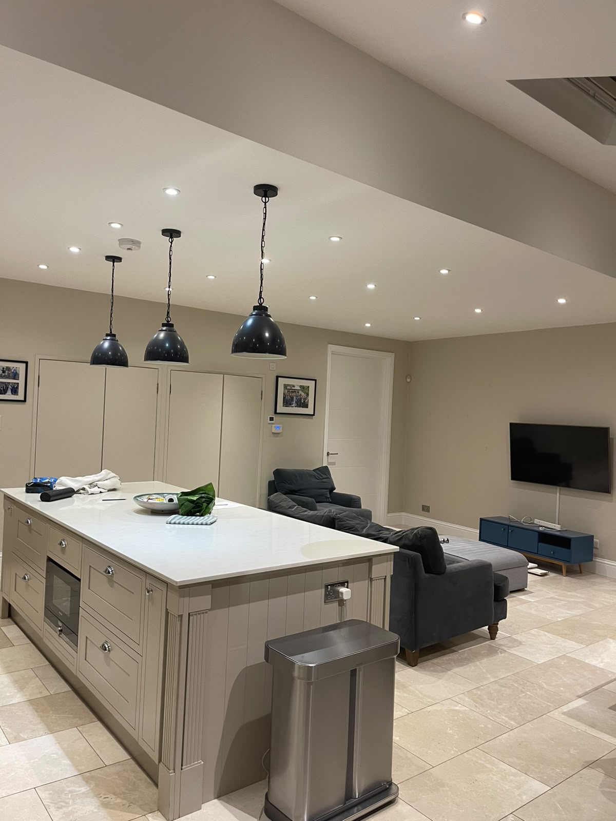 Open-plan kitchen and living room in a Wandsworth home with freshly painted walls and ceiling