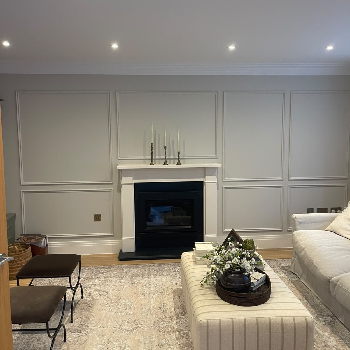 Decorative wall panelling around a fireplace by GPD Property Service